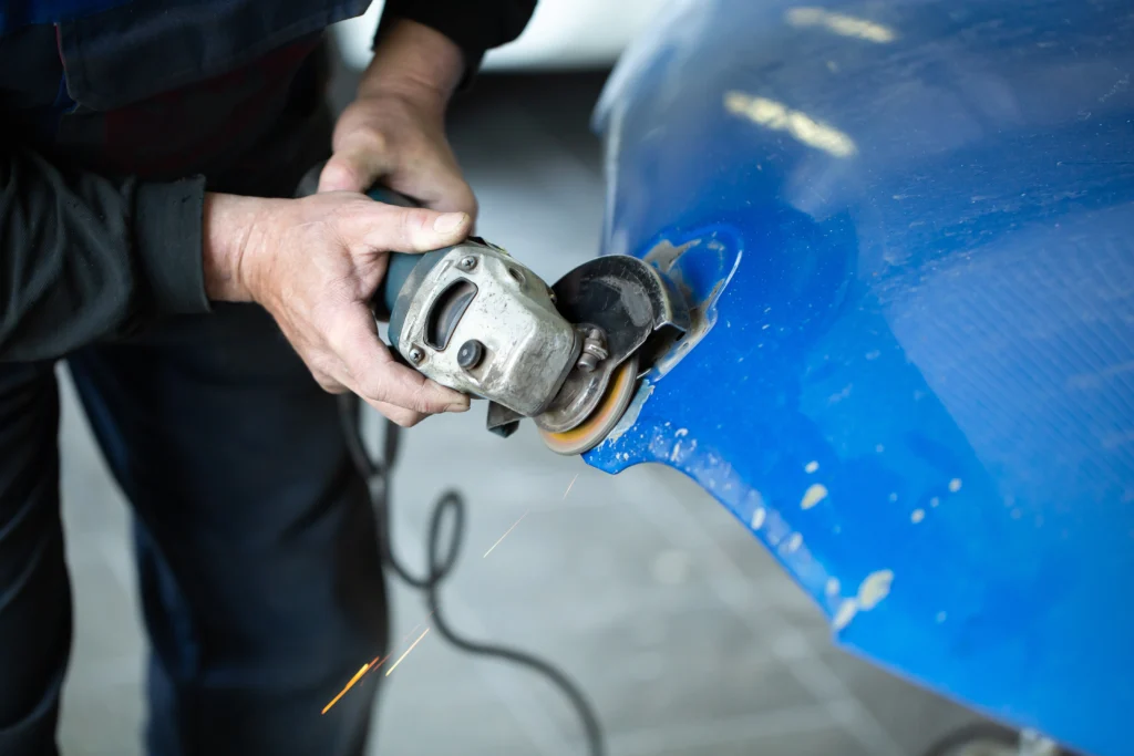 a man who sanding with a grinder and prepares the 2026 01 07 05 31 15 utc